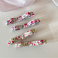 Beau Sweet Floral Print Hair Clip showing pink and white flowers on a curved clip