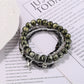 Lovra multi-row beaded bracelet with gold star pendant shown on white background