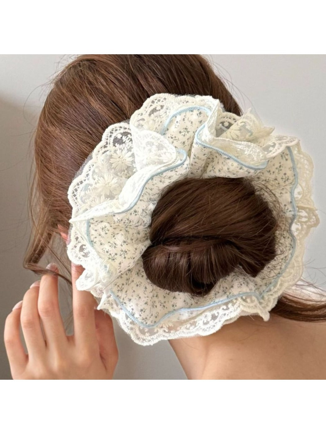 Side view of Gifty floral scrunchie showing delicate lace trim detail
