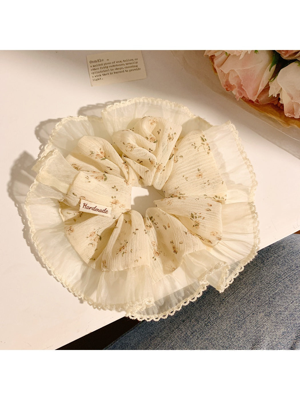 Close-up of Gifty minimalist vintage print scrunchie with muted floral pattern