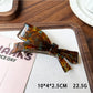 Beau acetate bow hair clip in packaging ready for sale
