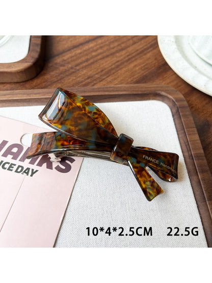 Beau acetate bow hair clip in packaging ready for sale