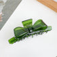 Top view of Beau bow shaped claw clip displaying symmetrical shape