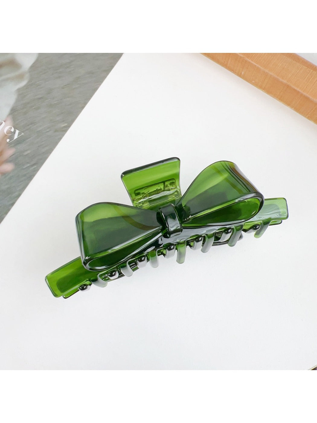 Top view of Beau bow shaped claw clip displaying symmetrical shape