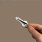 Beau key shaped hair clip holding back brown hair in a half-up hairstyle