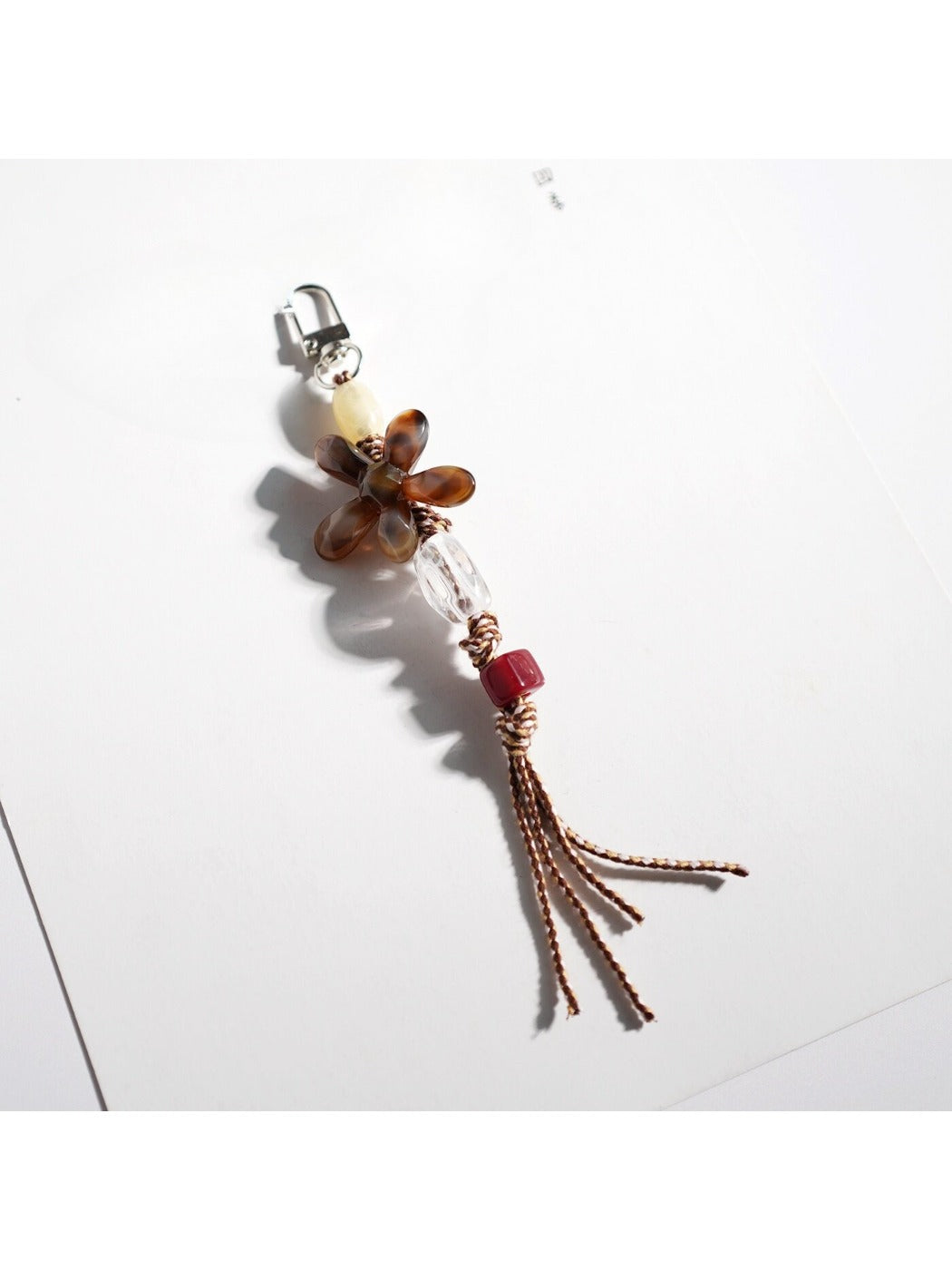 Side angle of Keypus acrylic beaded flower keychain highlighting bead colors
