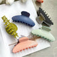 Beau polka dot acetate claw clip holding hair in a half-up hairstyle