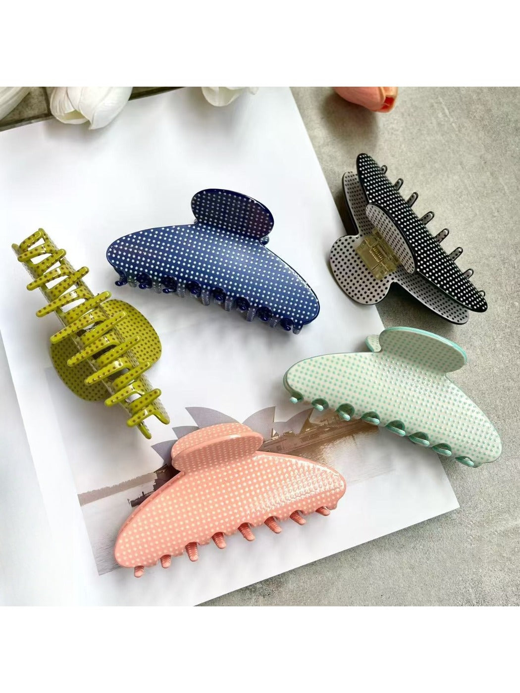 Beau polka dot acetate claw clip holding hair in a half-up hairstyle