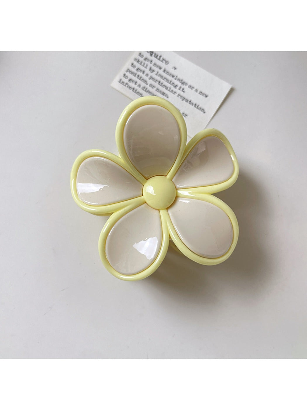 Beau flower shaped claw clip open to show inner clasp and hinge details