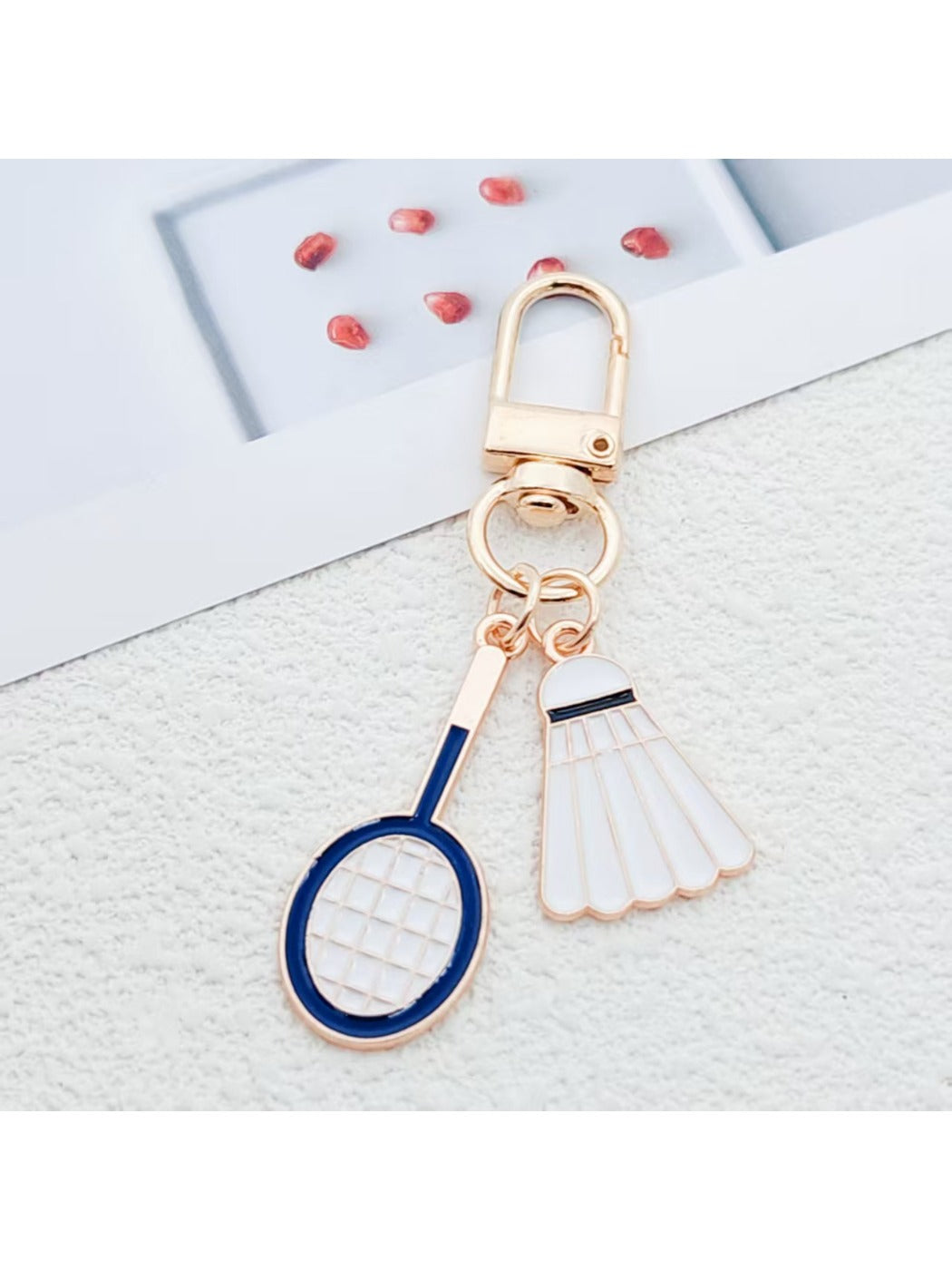 Close-up of badminton shuttlecock keychain showing detailed alloy craftsmanship