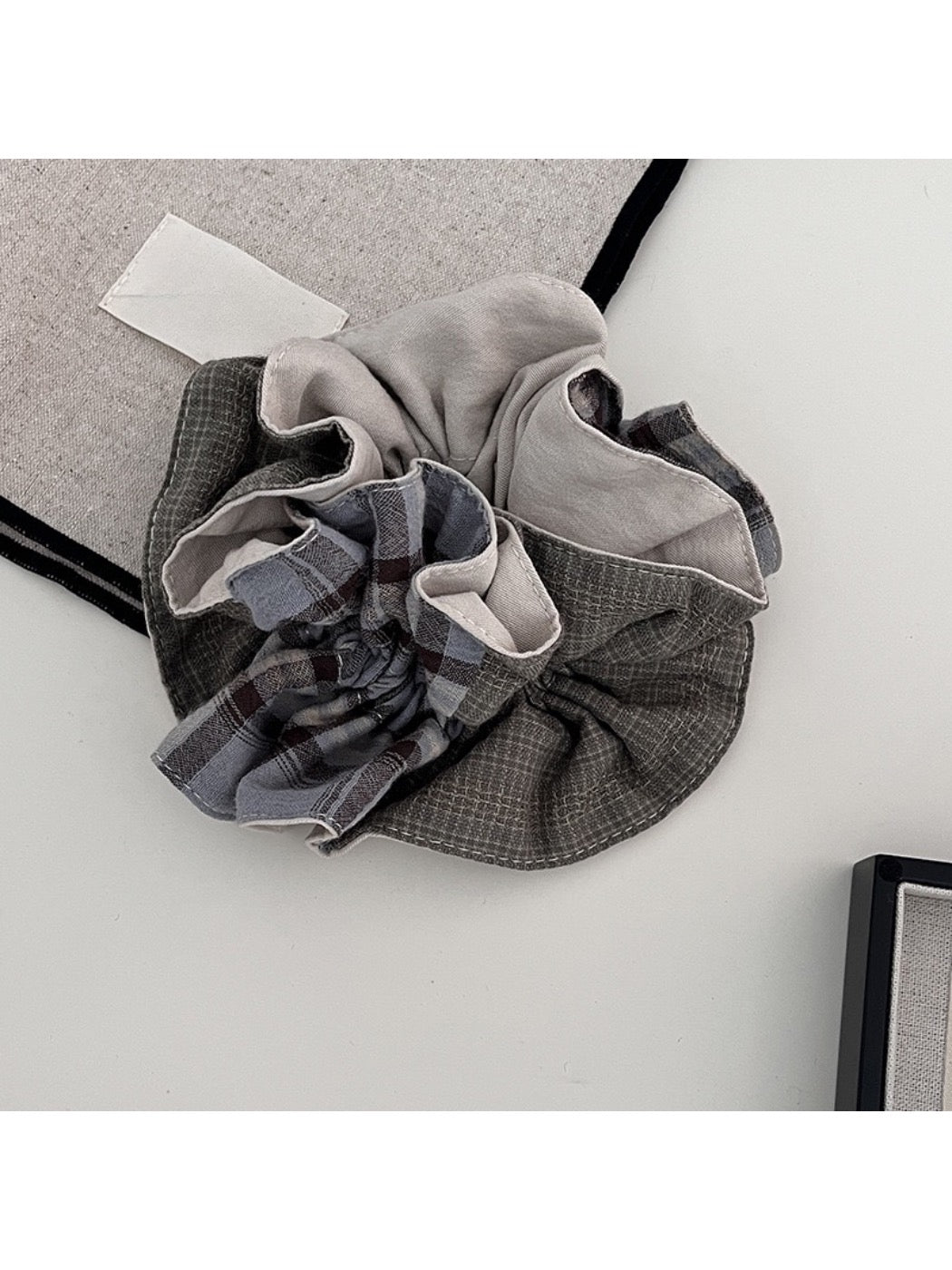 Gifty scrunchie displayed flat on white background highlighting fabric sheen