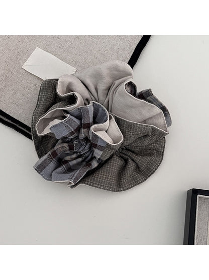 Gifty scrunchie displayed flat on white background highlighting fabric sheen