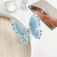 Beau butterfly claw clip styled in long hair from the back