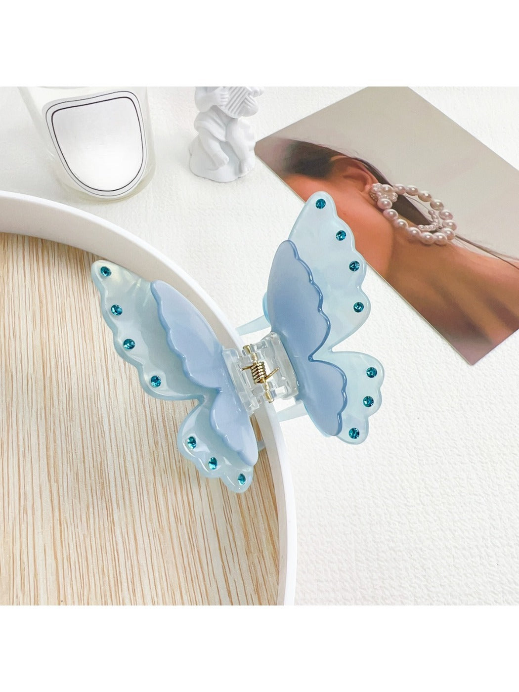 Beau butterfly claw clip styled in long hair from the back