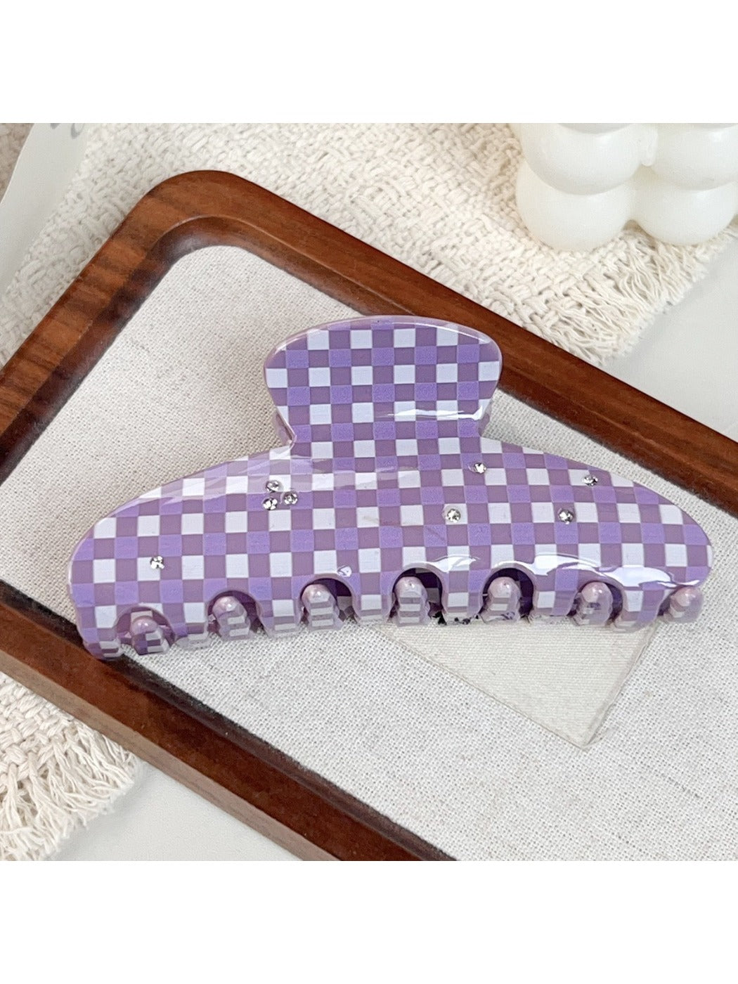 Purple plaid hair claw clip open showing inner teeth and clasp