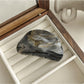 Beau gradient color blended claw clip placed on wooden surface