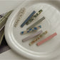 Close-up of Beau straight bar hair clip showing smooth acetate finish and clasp mechanism