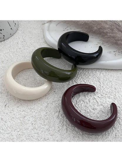 Lovra solid color open cuff ring with minimalist design on white background