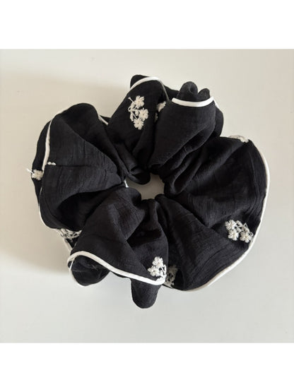Gifty small delicate mesh scrunchie styled in a woman's hair from the back