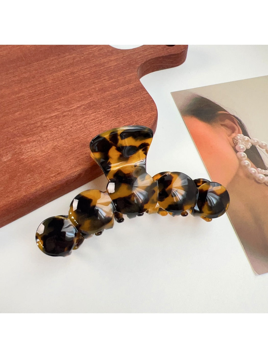 Beau hair claw clip securing medium-length wavy hair from the back