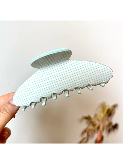 Beau polka dot acetate claw clip worn in long hair from back view
