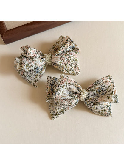 Side view of Beau Bow Tiny Floral Snap Hair Clip highlighting metal snap mechanism