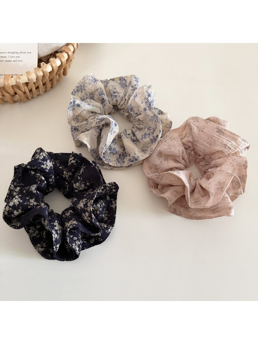 Close-up of Gifty vintage floral print ruffled scrunchie with pink and green flowers