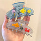 Side view of Beau fish decor claw clip highlighting the curved design