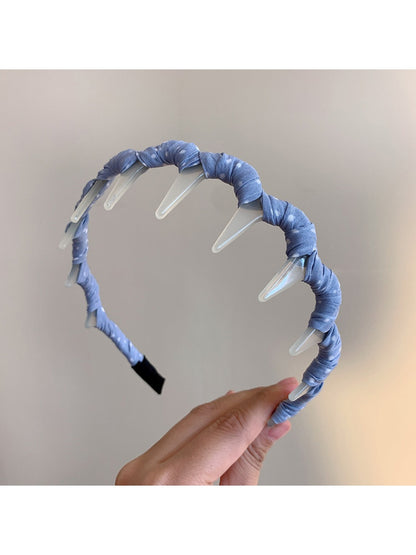 Back view of Gifty polka dot toothed comb headband showing flexible comb teeth
