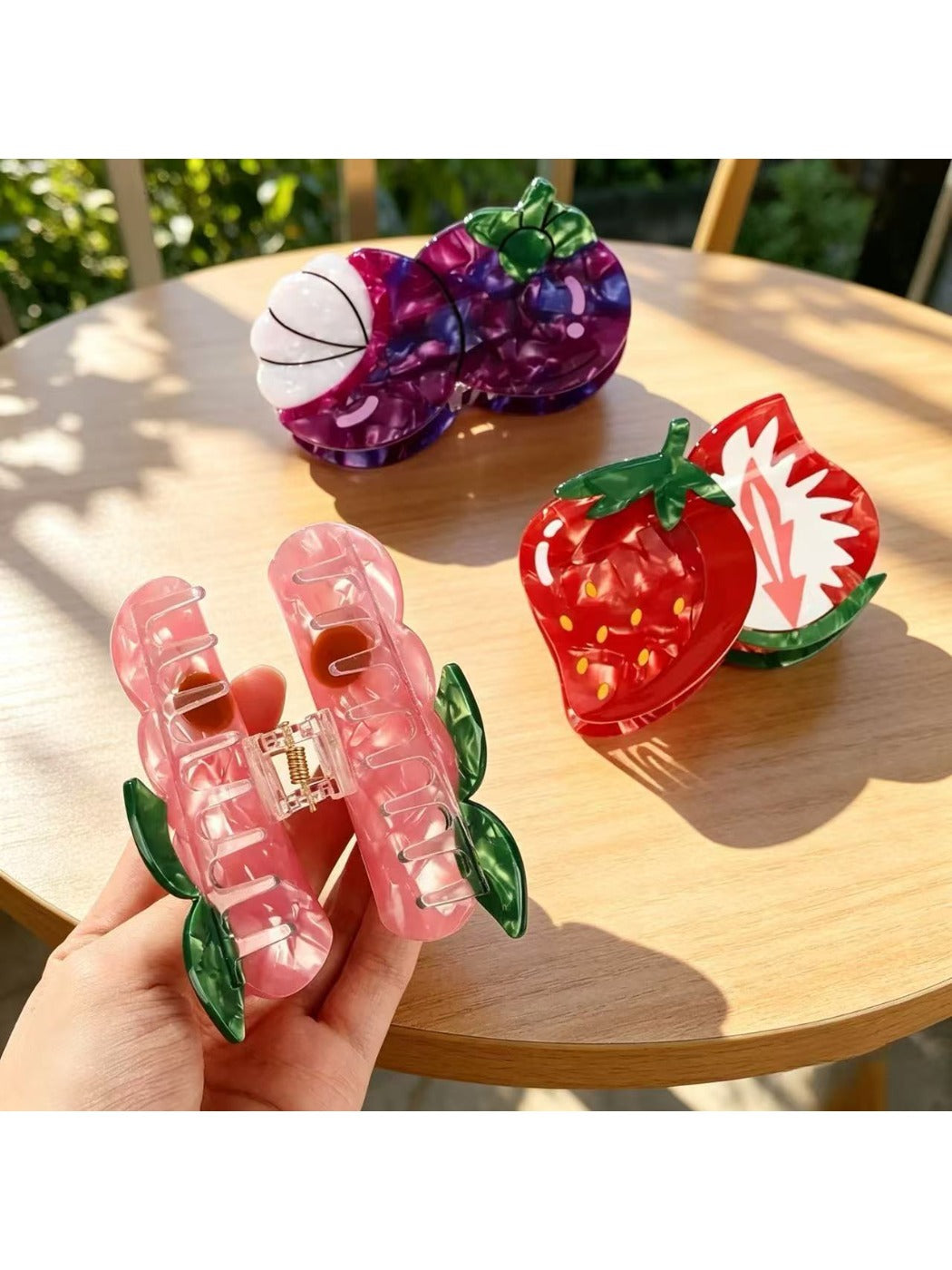 Close-up of Beau peach fruit claw clip showing detailed texture