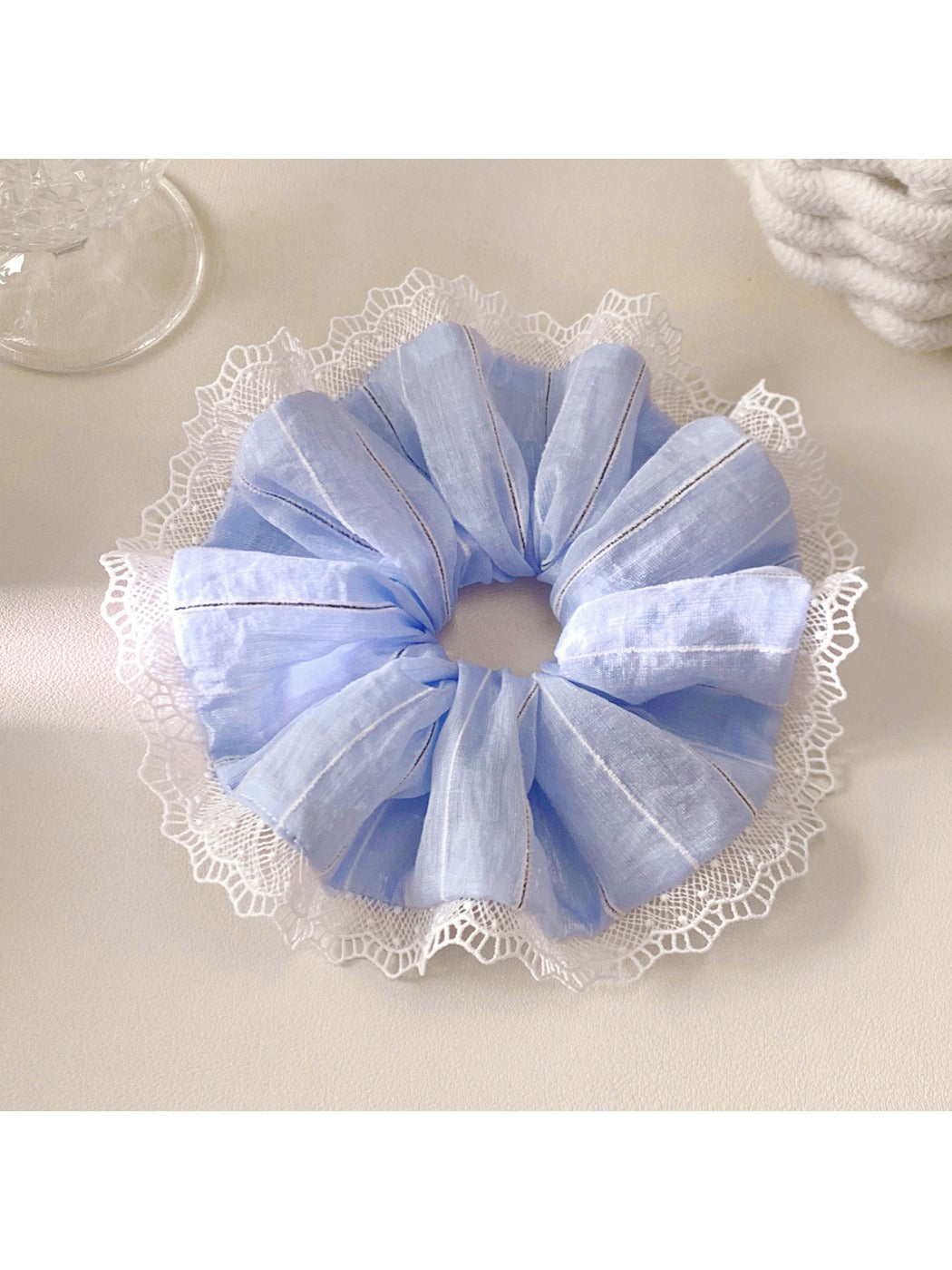 Close-up of Gifty elegant striped ruched scrunchie in soft fabric