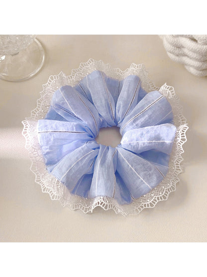 Close-up of Gifty elegant striped ruched scrunchie in soft fabric