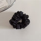Scrunchie styled on a wrist as a casual accessory
