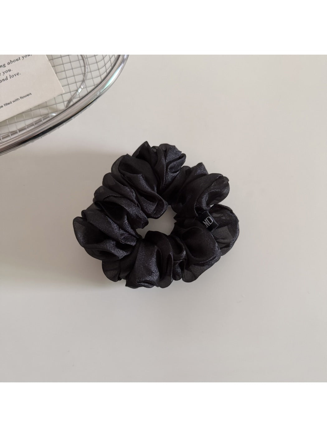 Scrunchie styled on a wrist as a casual accessory