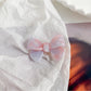 Beau delicate bow hair clip in soft pink with subtle gold thread details