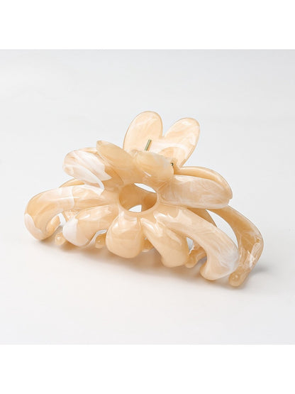Model wearing Beau flower hair clip with loose waves