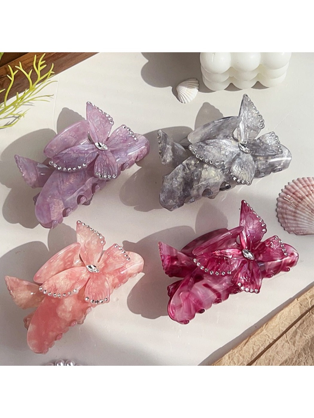 Side view of Beau butterfly decorated hair claw clip highlighting clip mechanism