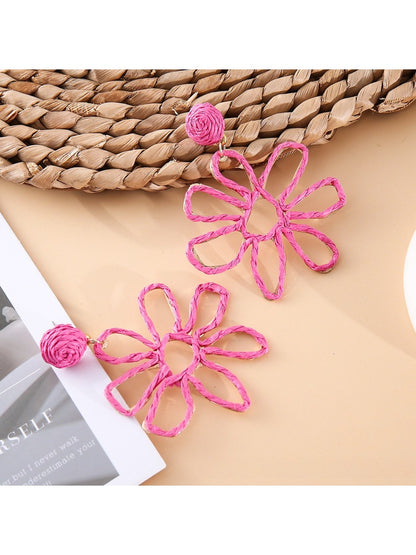 Earedge flower shaped openwork drop earrings worn on model's ear