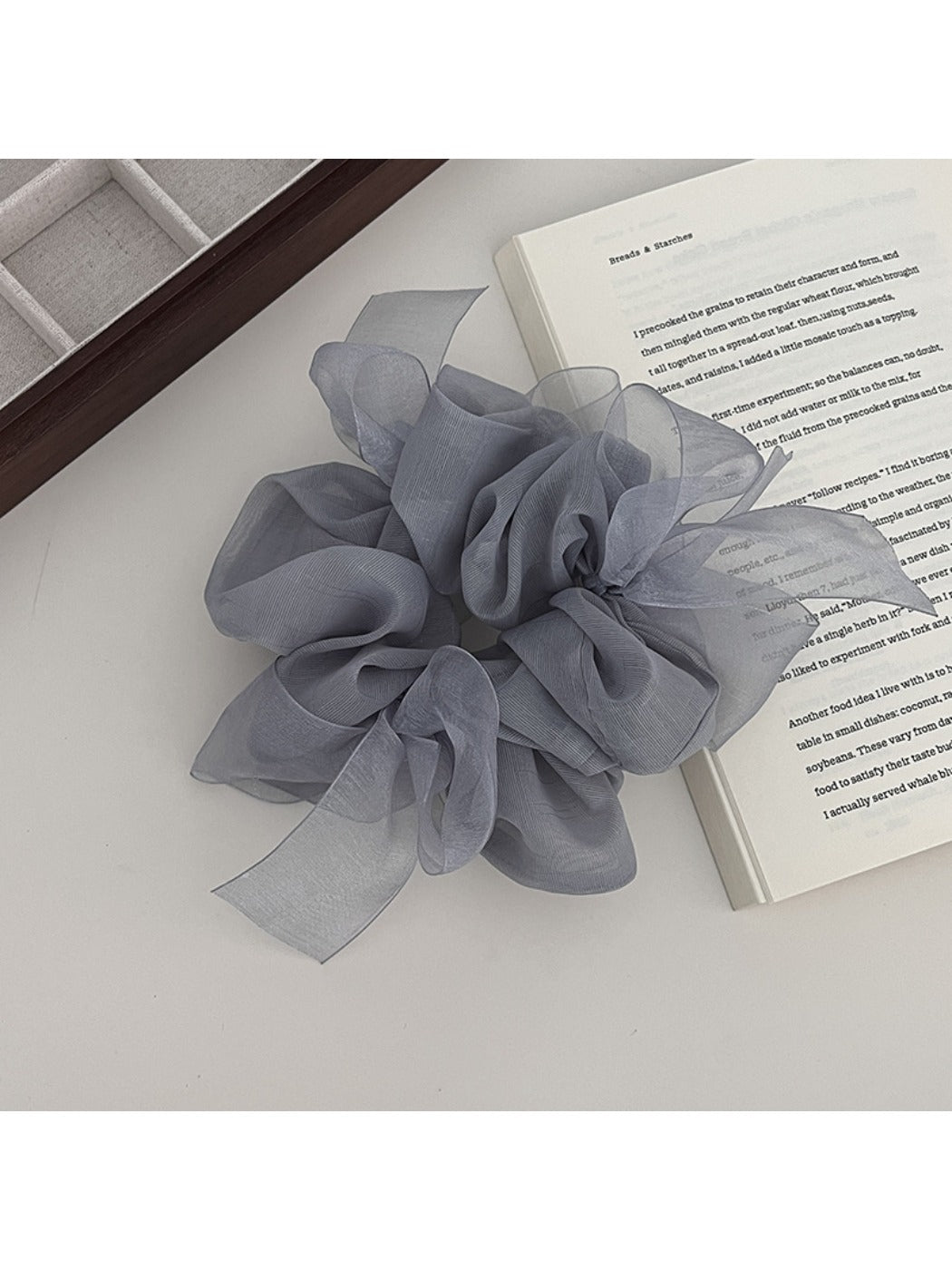 Gifty scrunchie with bow accent styled in a ponytail