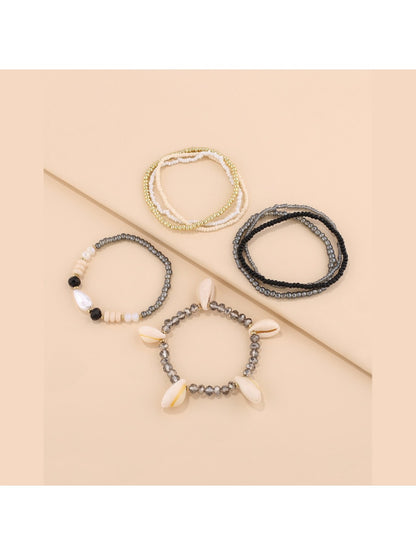 Lovra bracelet worn on wrist showing shell and bead details