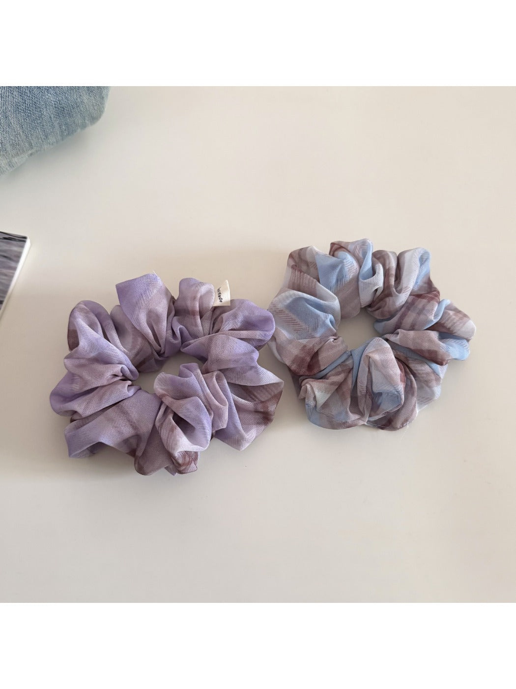 Side view of Gifty two tone checkered scrunchie showing fabric texture