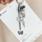 Close-up of the dancing girl charm showing smooth silver finish