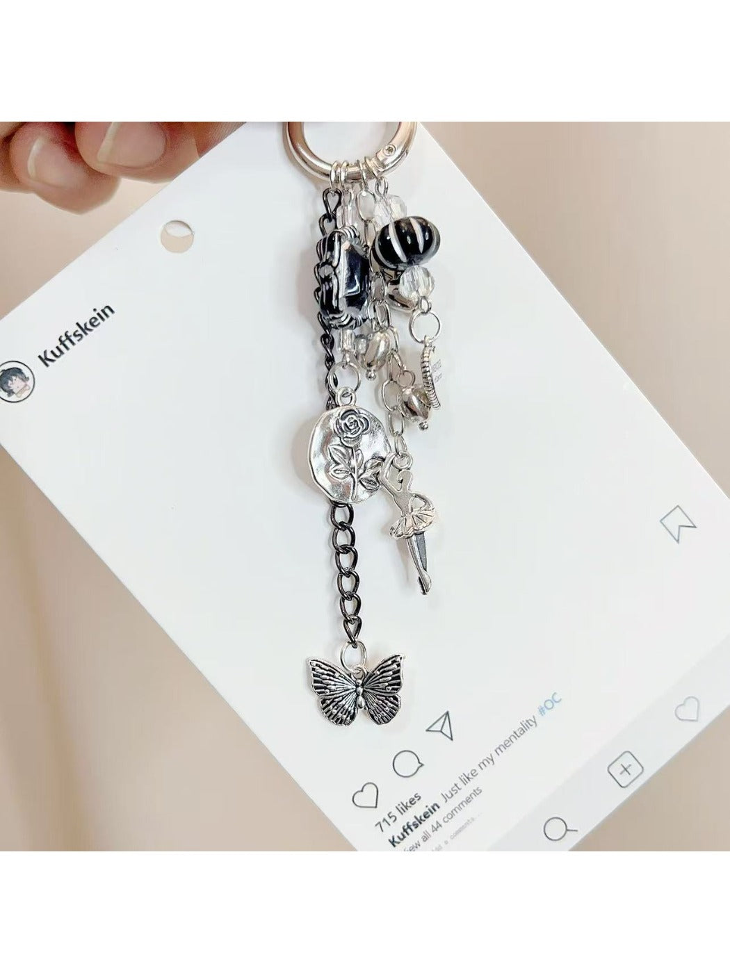 Close-up of the dancing girl charm showing smooth silver finish