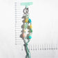 Close-up of multicolored resin beads strung together on a keychain