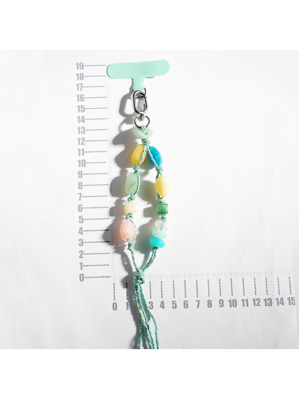 Close-up of multicolored resin beads strung together on a keychain