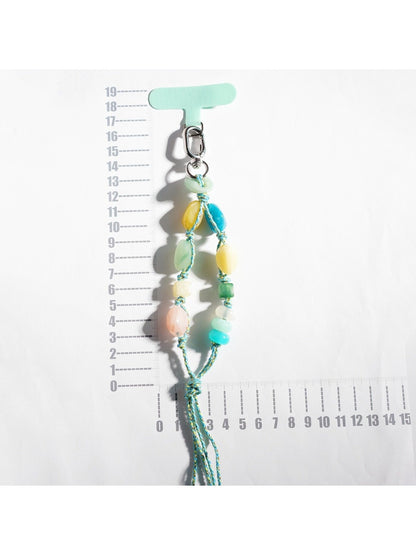 Close-up of multicolored resin beads strung together on a keychain