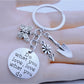 Butterfly flower shaped keychain with pink and purple petals on a white background