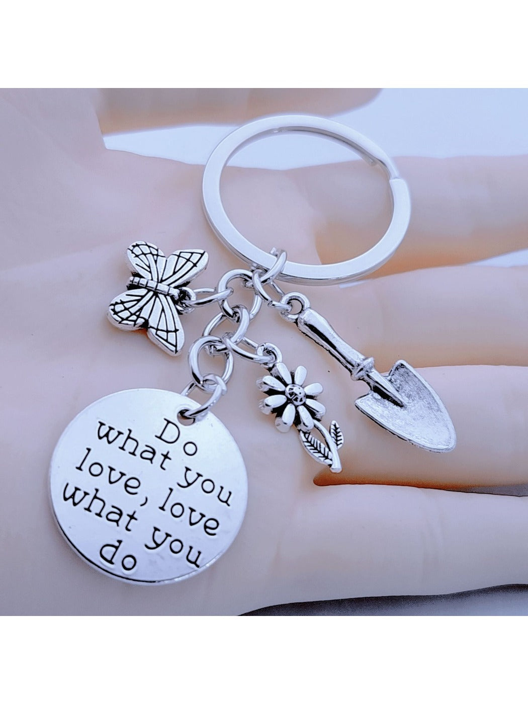 Butterfly flower shaped keychain with pink and purple petals on a white background