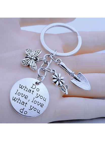 Butterfly flower shaped keychain with pink and purple petals on a white background