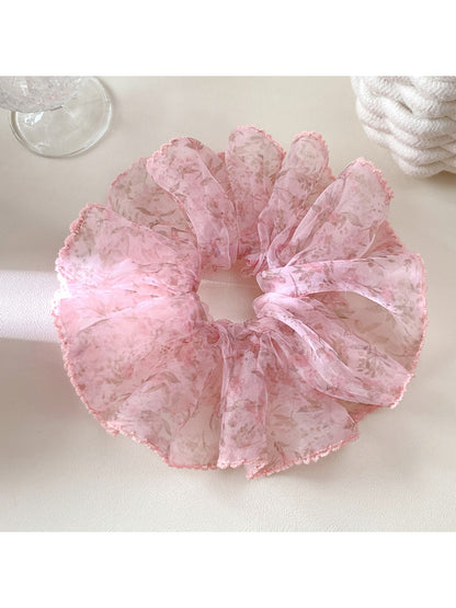 Gifty vintage printed scrunchie next to matching hair accessories